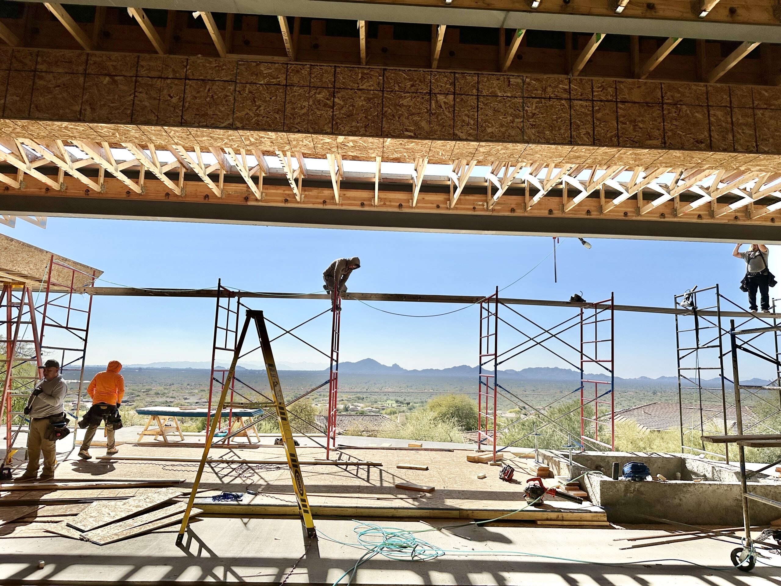 The before view of the kitchen and great room looking out at the Ancala Hillside Residence in Scottsdale Arizona.